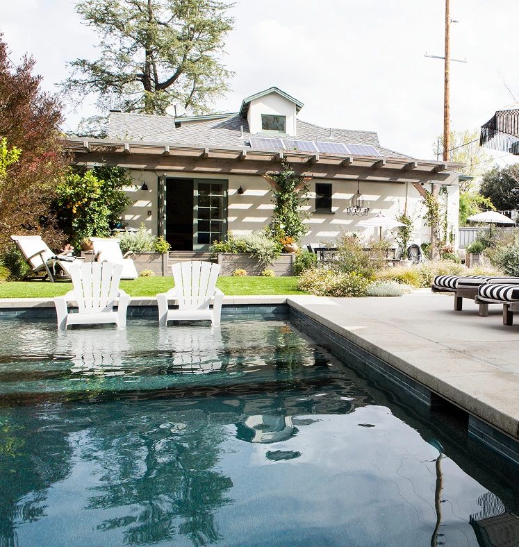 beautiful landscaped backyard with pool