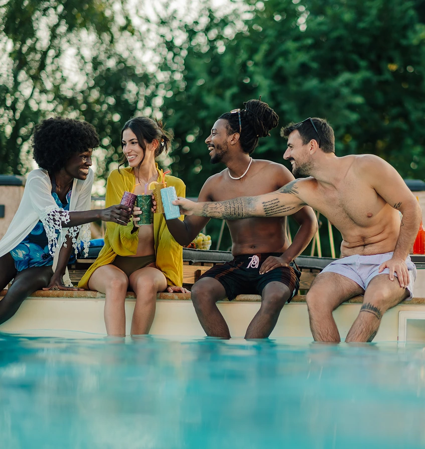 group enjoying poolside drinks