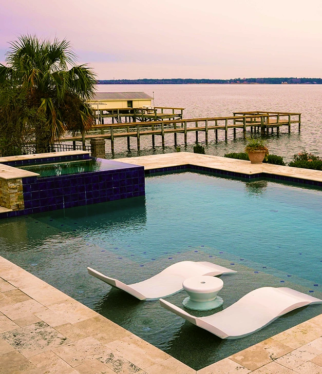 modern pool with lounge chairs