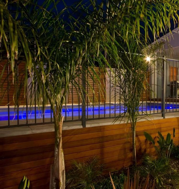 residential pool with garden lights