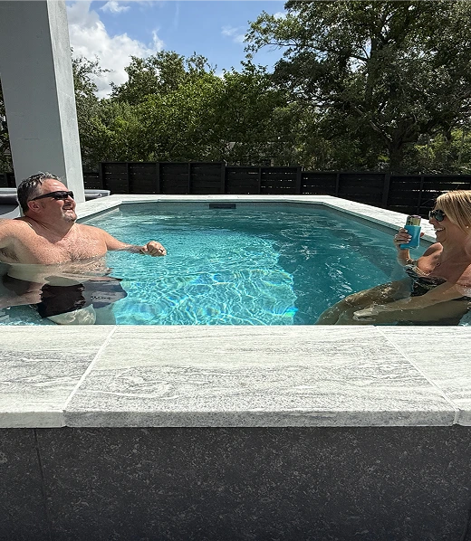 couple enjoying the mini pool